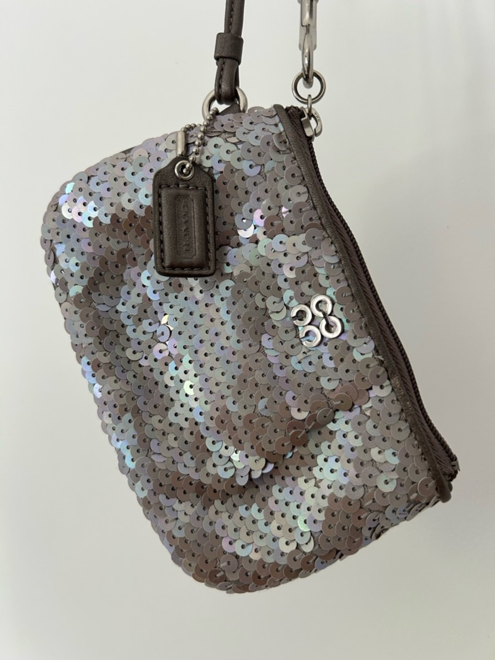 Adorable sequined Coach wristlet.